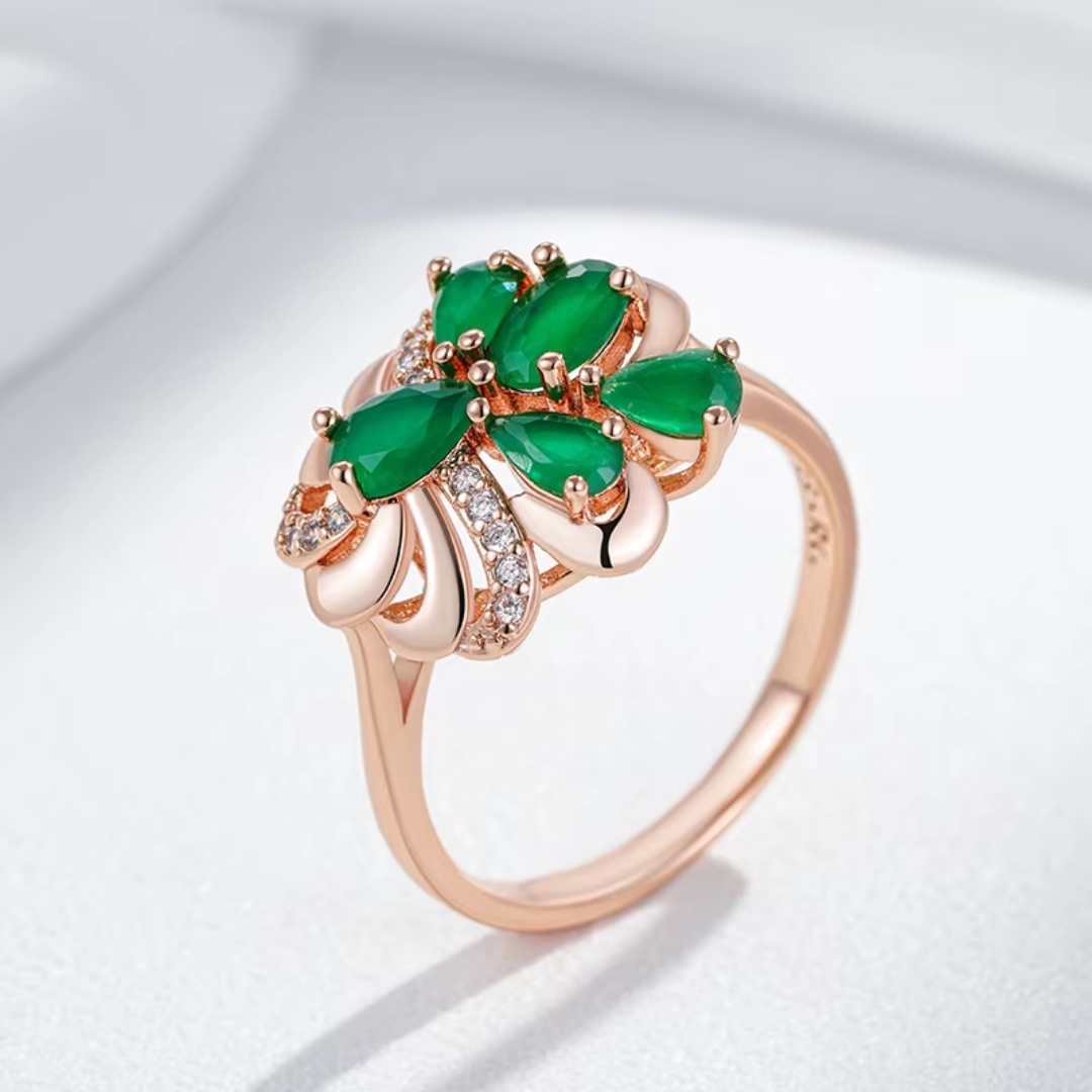 Bague en Or Rose avec Pierres Vertes et Nœud de Diamants