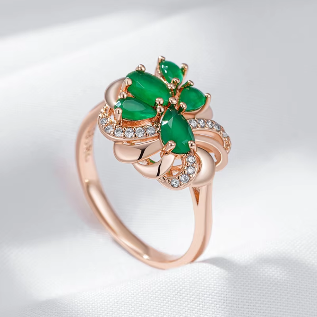 Bague en Or Rose avec Pierres Vertes et Nœud de Diamants
