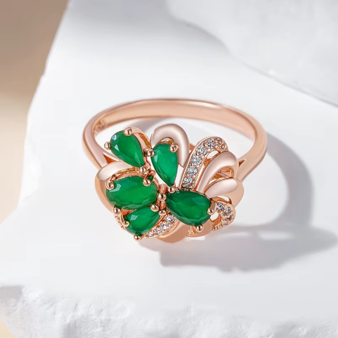 Bague en Or Rose avec Pierres Vertes et Nœud de Diamants