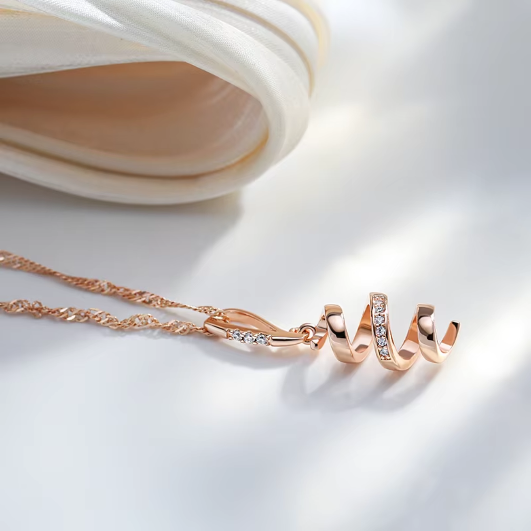 Collier en Or Rose avec Pendentif Spirale et Cristaux